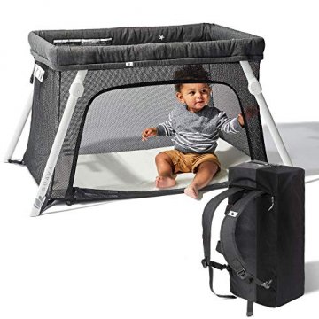Lotus travel crib with carry case and child 
